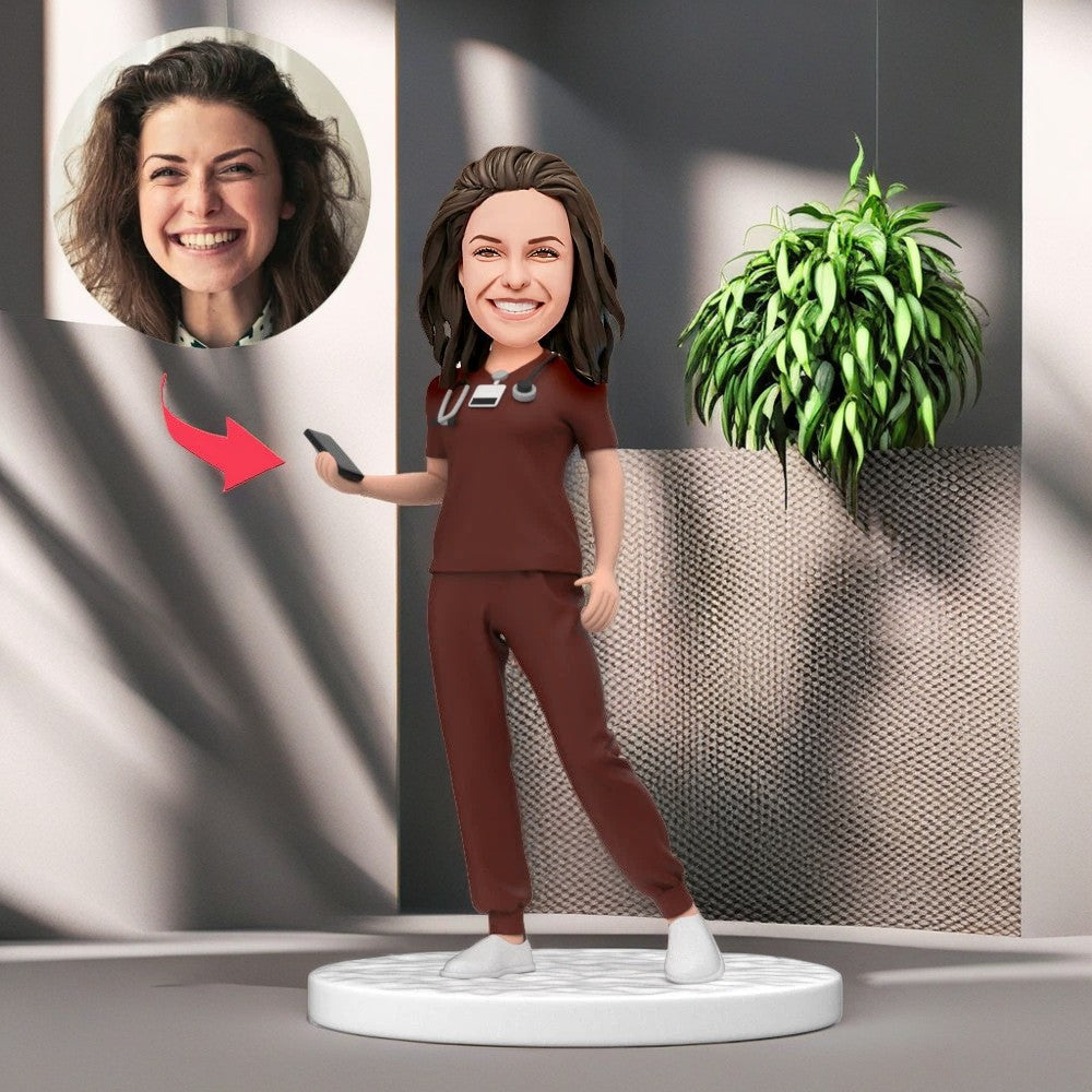 Personalized Female Doctor Bobblehead in Red Scrubs Holding a Mobile Phone with Engraved Text National Doctor's Day Gift